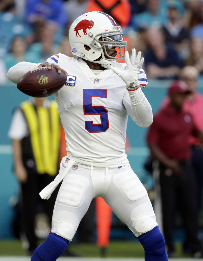 Buffalo Bills quarterback Tyrod Taylor (5) looks to pass, during the first half of an NFL football game against the Miami Dolphins, Sunday, Dec. 31, 2017, in Miami Gardens, Fla. (AP Photo/Lynne Sl ...