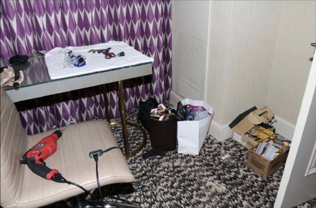 A desk in the master bedroom of 32-135 with a SCUBA mask and a power hand drill. LVMPD.