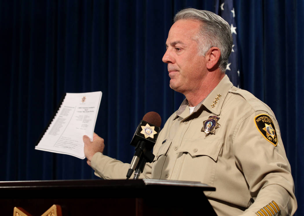 Clark County Sheriff Joe Lombardo shows a preliminary report to be released on the investigation into the Oct. 1 mass shooting on the Strip during a news conference at Metropolitan Police Departme ...