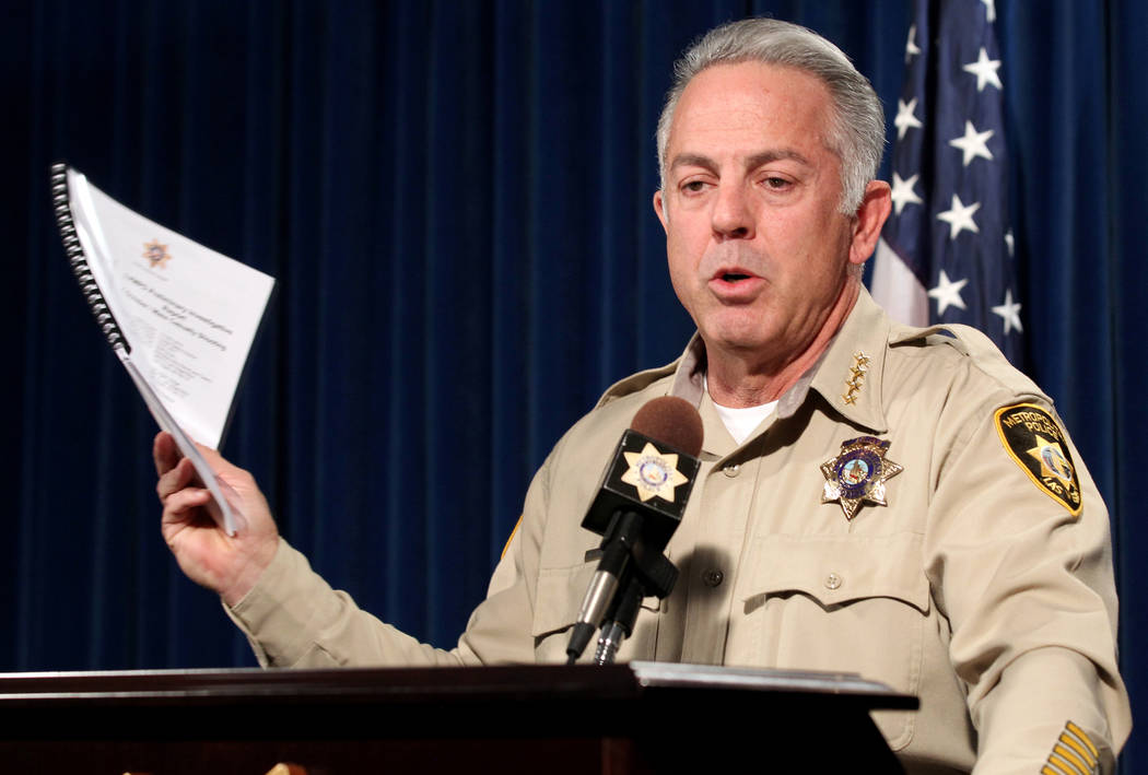 Clark County Sheriff Joe Lombardo shows a preliminary report to be released on the investigation into the Oct. 1 mass shooting on the Strip during a news conference at Metropolitan Police Departme ...