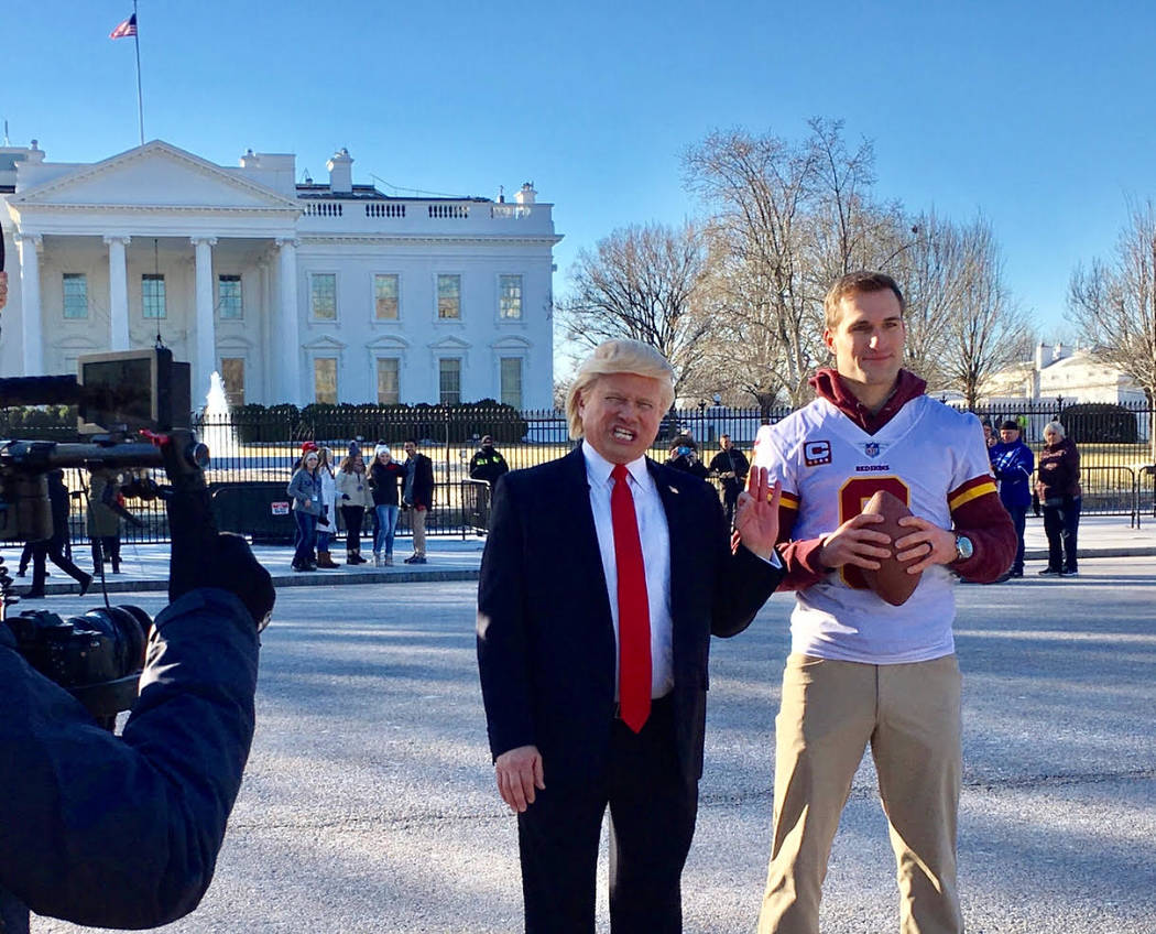 Las Vegas tribute artist John Di Domenico, in his President Trump persona, works with Washington Redskins quarterback Kirk Cousins during a commercial shoot at the White House on Thursday, Jan. 18 ...