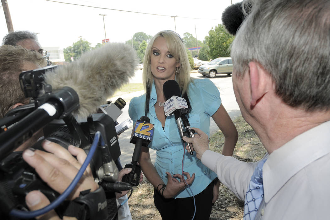 Porn star Stormy Daniels talks with the media outside of the Southfield Grill in Shreveport, La., on Friday, July 3, 2009.  At the time, she was planning to make a run against incumbent U.S. Sen.  ...