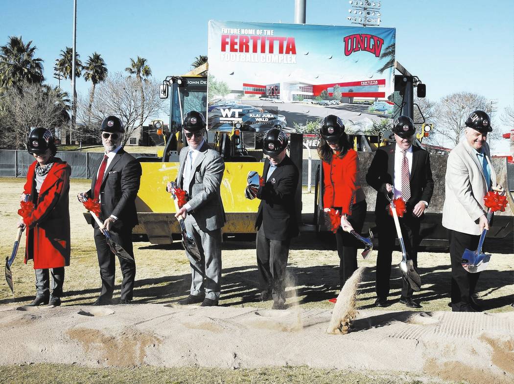 Vicki Fertitta, left, Lorenzo Fertitta, Frank Fertitta, UNLV President Dr. Len Jessup, Director of Athletics Desiree Reed-Francois, UNLV football head coach Tony Sanchez, and Clark County Commissi ...