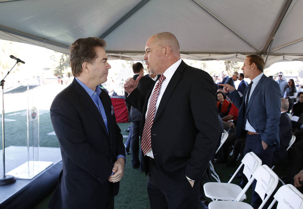 UNLV President Dr. Len Jessup, left, and UNLV football head coach Tony Sanchez chat prior to the groundbreaking ceremony for the Fertitta Football Complex on Tuesday, Jan. 23, 2018 in Las Vegas. ( ...
