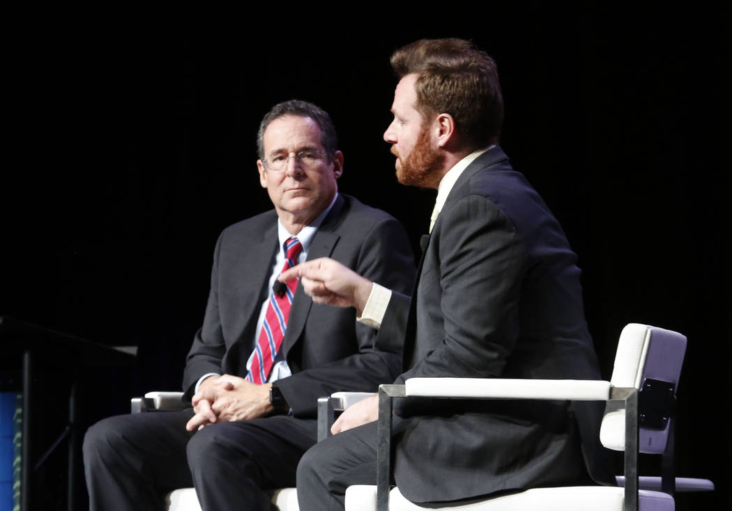 John Hudak, right, speaks during Preview Las Vegas, the Las Vegas Metropolitan Chamber of Commerce's largest annual networking event, as Rob Lang looks on at Cox Pavilion on Friday, Jan. 26, 2018, ...