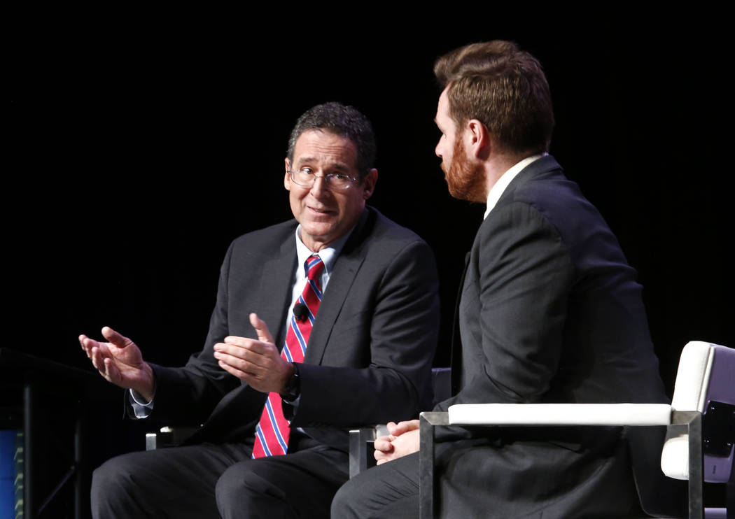 Rob Lang, left, speaks during Preview Las Vegas, the Las Vegas Metropolitan Chamber of Commerce's largest annual networking event, as John Hudak looks on at Cox Pavilion on Friday, Jan. 26, 2018, ...