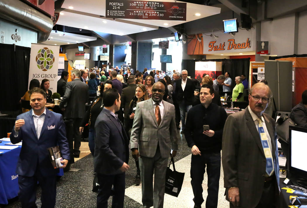 Exhibitgoers arrive at Preview Las Vegas, the Las Vegas Metropolitan Chamber of Commerce’s largest annual networking event, at Cox Pavilion on Friday, Jan. 26, 2018, in Las Vegas. (Bizuayehu Tes ...