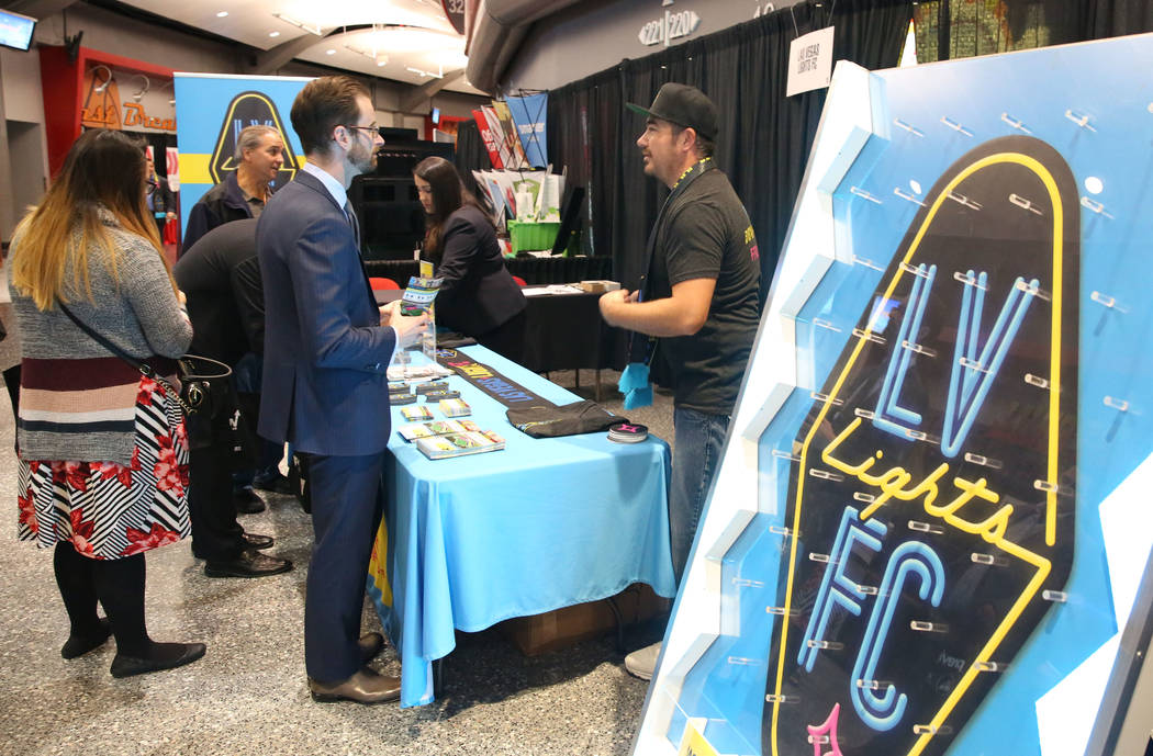 Martin Corbett, right, team ambassador for the Las Vegas Lights FC, speaks with exhibit-goers during Preview Las Vegas, the Las Vegas Metropolitan Chamber of Commerceճ largest annual network ...