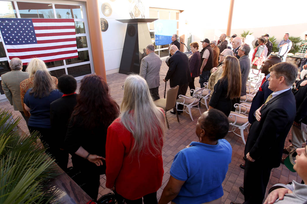 Veterans and supporters recite the Pledge of Allegiance at Veterans Village 2 in downtown Las Vegas Wednesday, Jan. 24, 2018, before a speech from Republican gubernatorial candidate Nevada Attorne ...