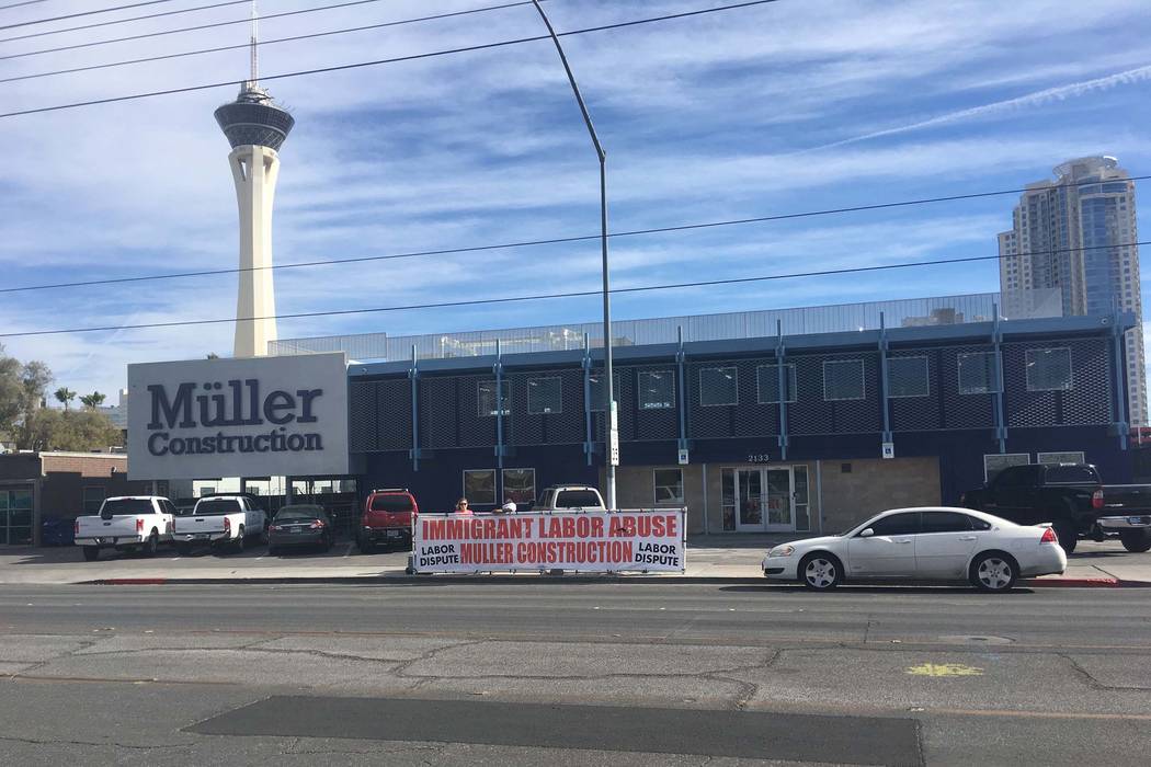 A banner protesting Muller Construction is seen outside the company's headquarters in Las Vegas, Thursday, Jan. 25, 2018. Muller Construction is suing Laborers Local 872 union for allegedly conduc ...