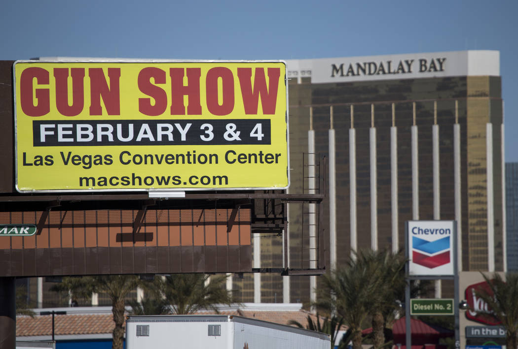 A billboard advertising a gun show is seen along the Vegas Strip south of the Mandalay Bay near the Las Vegas Festival Grounds, site of the Route 91 Harvest shooting, Sunday, Jan. 28, 2018. Richar ...