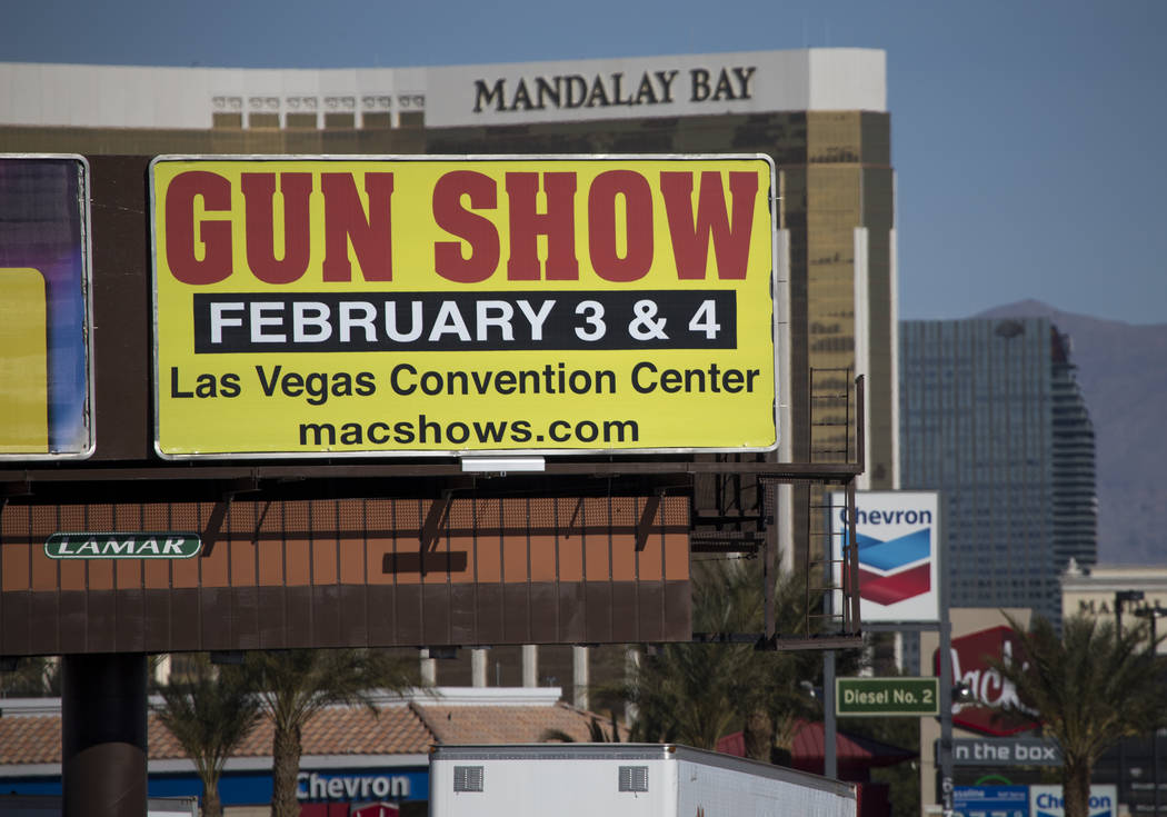 A billboard advertising a gun show is seen along the Vegas Strip south of the Mandalay Bay near the Las Vegas Festival Grounds, site of the Route 91 Harvest shooting, Sunday, Jan. 28, 2018. Richar ...