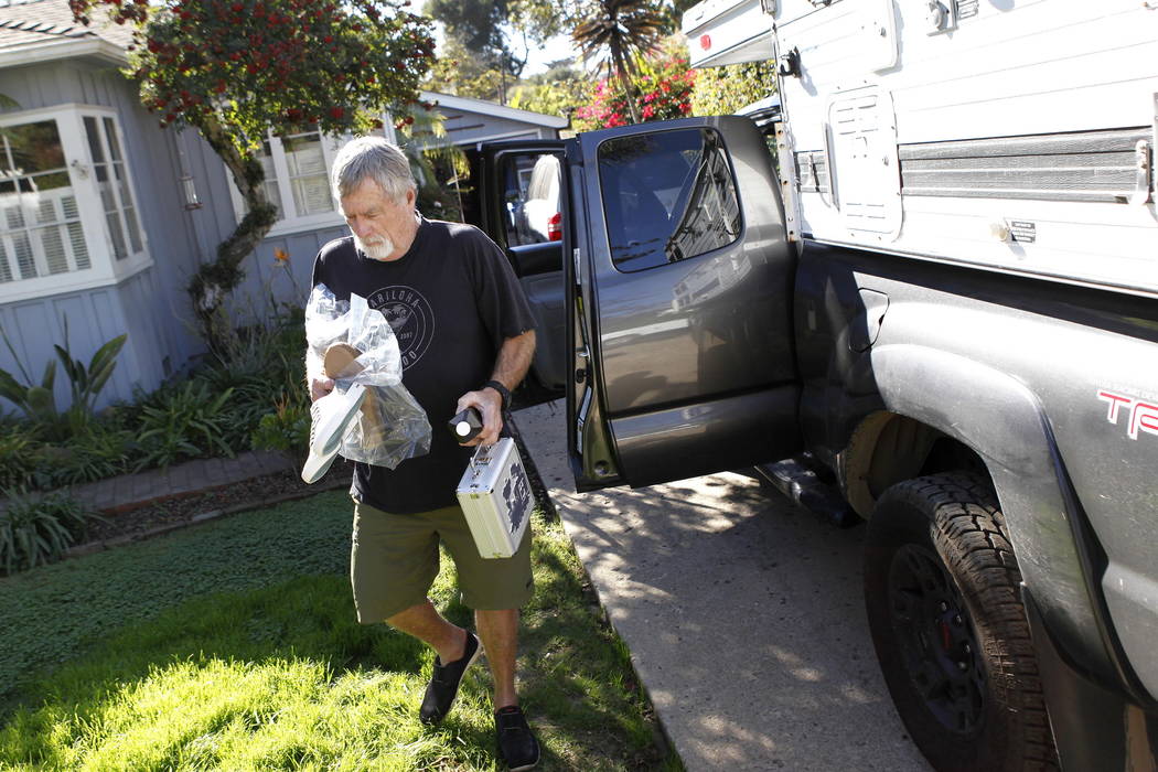 Eric Arneson unloads his truck after returning to his home in Montecito, Calif., Thursday, Jan. 25, 2018. (AP Photo/Daniel Dreifuss)