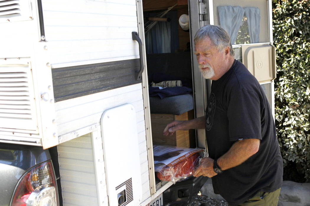 Eric Arneson unloads his truck as he returns to his home in Montecito, Calif., Thursday, Jan. 25, 2018. (AP Photo/Daniel Dreifuss)