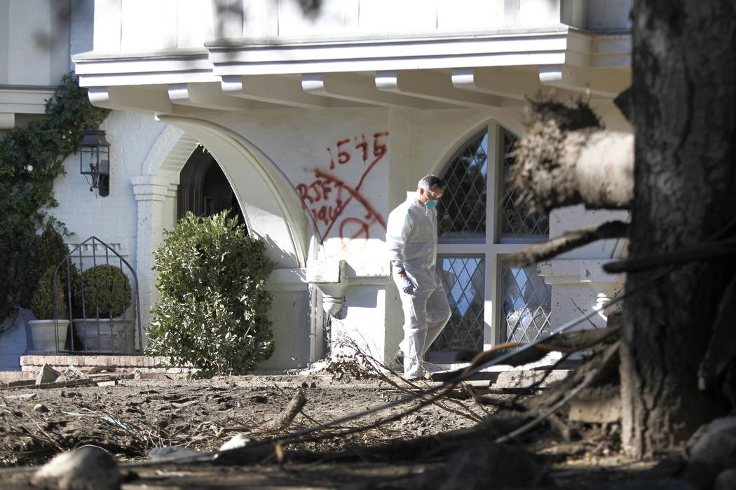 A Montecito resident searches his home for the first time near East Valley Road in Montecito, Calif., Thursday, Jan. 25, 2018. (AP Photo/Daniel Dreifuss)