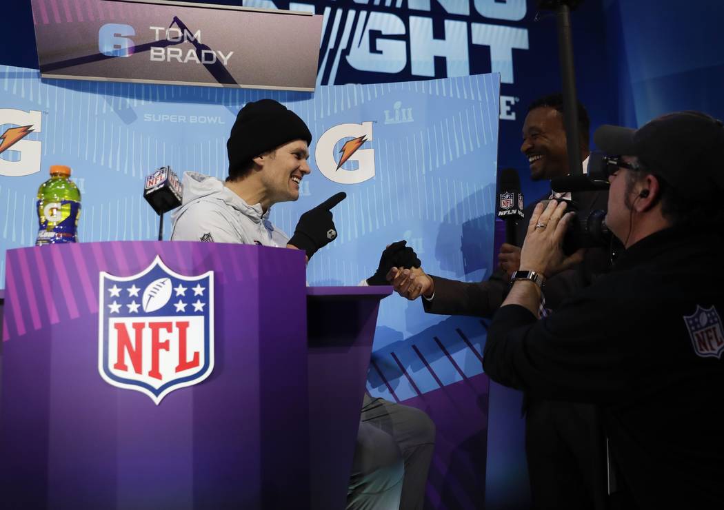 New England Patriots' Tom Brady answers questions during NFL football Super Bowl 52 Opening Night Monday, Jan. 29, 2018, at the Xcel Center in St. Paul, Minn. (AP Photo/Matt Slocum)