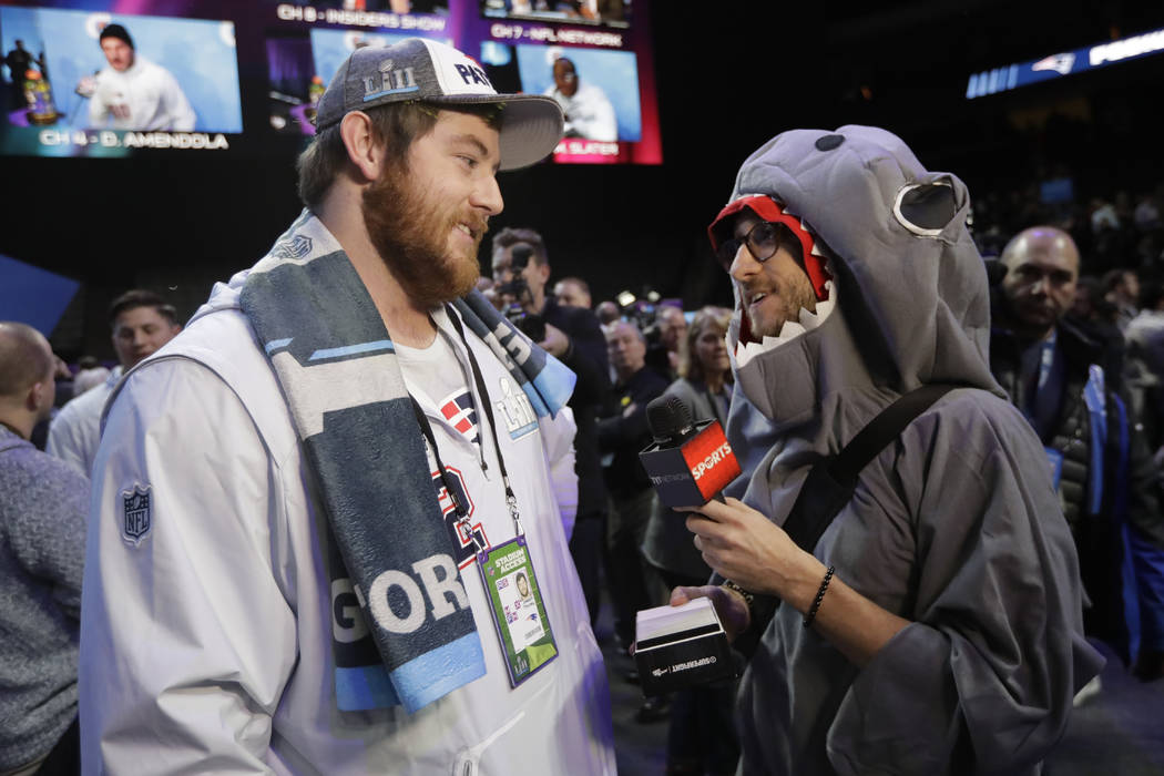 New England Patriots' Joe Thuney is interviewed during NFL football Super Bowl 52 Opening Night Monday, Jan. 29, 2018, at the Xcel Center in St. Paul, Minn. (AP Photo/Eric Gay)