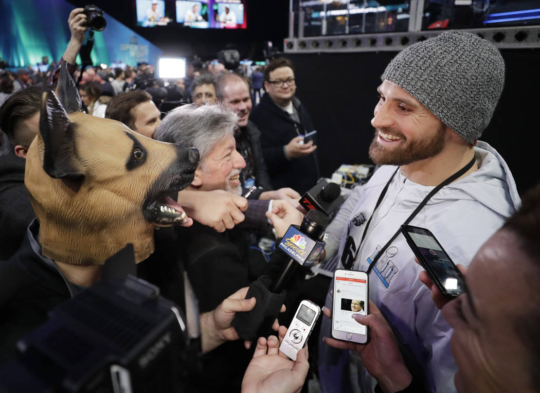 Philadelphia Eagles' Chris Long is interviewed during NFL football Super Bowl 52 Opening Night Monday, Jan. 29, 2018, at the Xcel Center in St. Paul, Minn. (AP Photo/Matt Slocum)