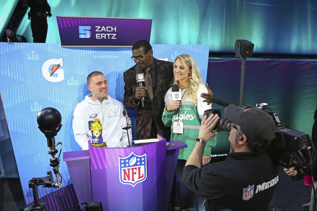 From (L-R) Philadelphia Eagles tight end Zach Ertz is interviewed by Michael Irvin, and Zach's wife Julie Ertz during opening night for the NFL Super Bowl 52 football game at Xcel Energy Center on ...