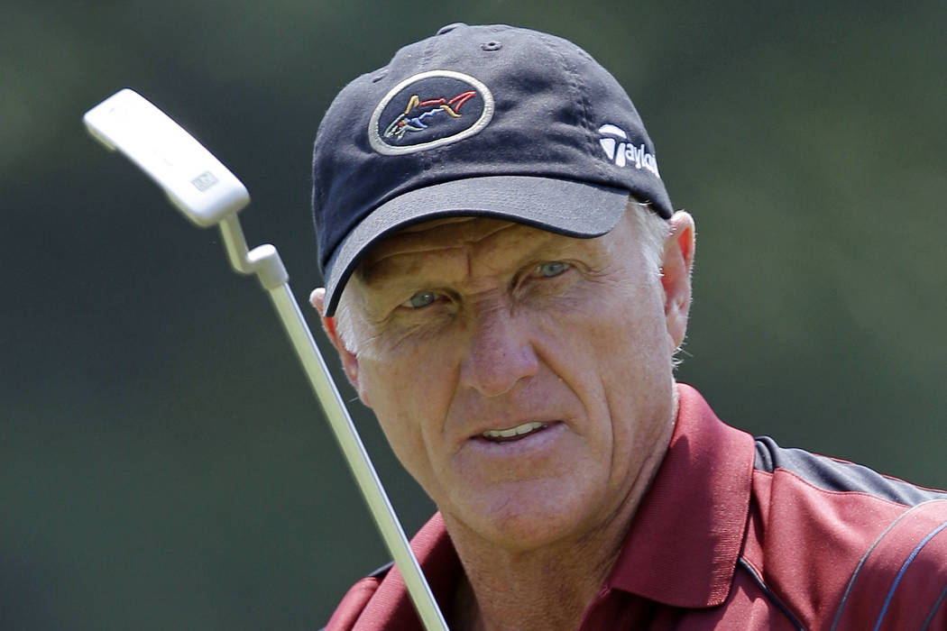FILE - In this June 28, 2012 file photo, Greg Norman watches his putt on the 16th hole during the first round of the Senior Players Championship golf tournament at the Fox Chapel Country Club in F ...