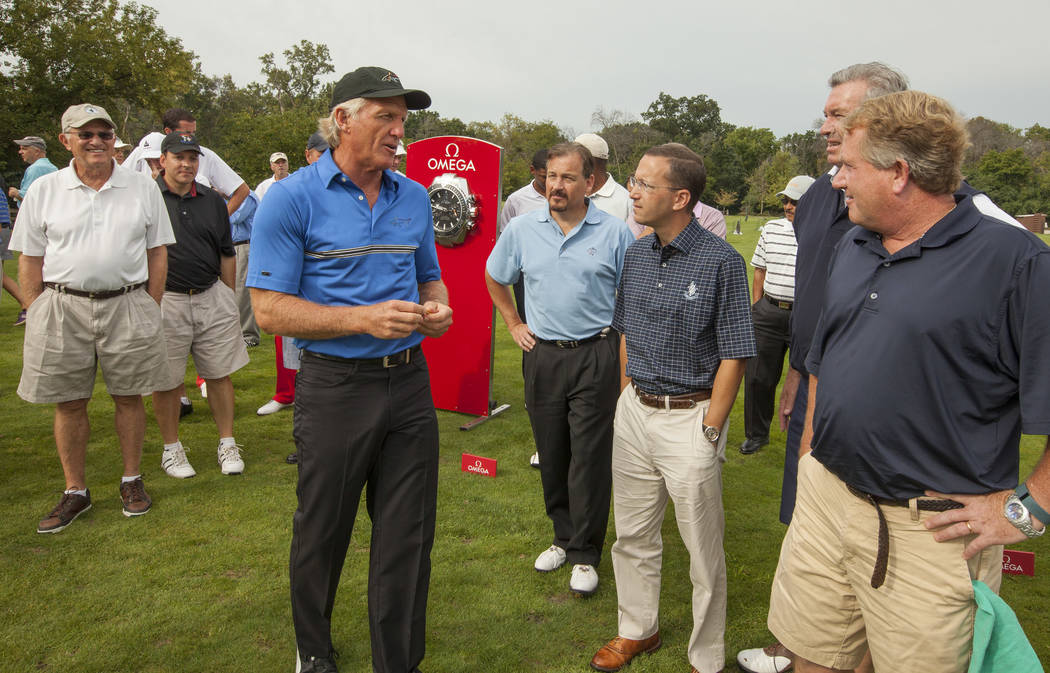 Golf Legend and OMEGA Ambassador Greg Norman, in center with black hat, hosts an exclusive golf clinic for VIP guests on Tuesday, September 9, 2014 at Oak Park Country Club in River Grove, IL. (Ph ...