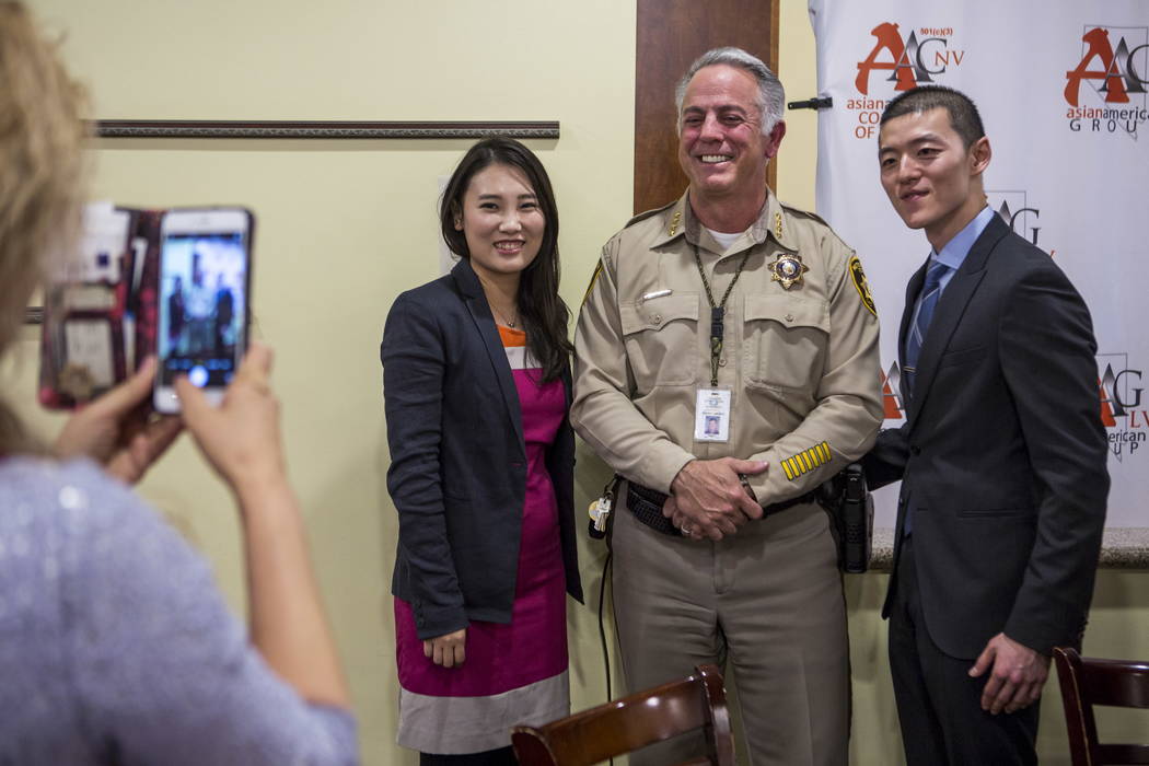 Clark County Sheriff Joe Lombardo has his picture taken with members of the Asian American community in Las Vegas during a dinner event at the Hong Kong Garden Seafood & Dim Sum Cafe on Spring ...