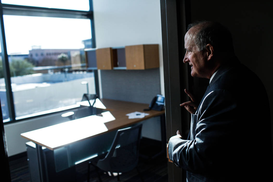 Stowe Shoemaker, dean of the William F. Harrah College of Hotel Administration, peers inside an office at Hospitality Hall at UNLV in Las Vegas, Thursday, Dec. 21, 2017. The building is set to ope ...