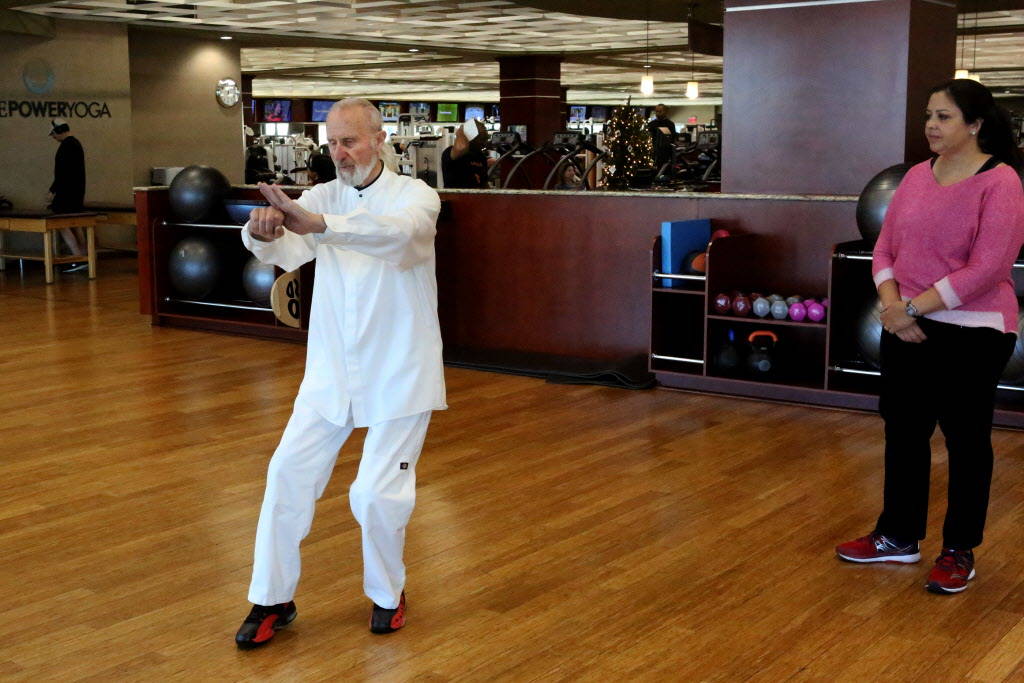Life Time Fitness Ambassador Laurence Berkley demonstrates movement in Tai Chi to student, Connie Kellers, at the Life Time Athletic in Summerlin on Wednesday, Dec. 20, 2017. Michael Quine Las Veg ...