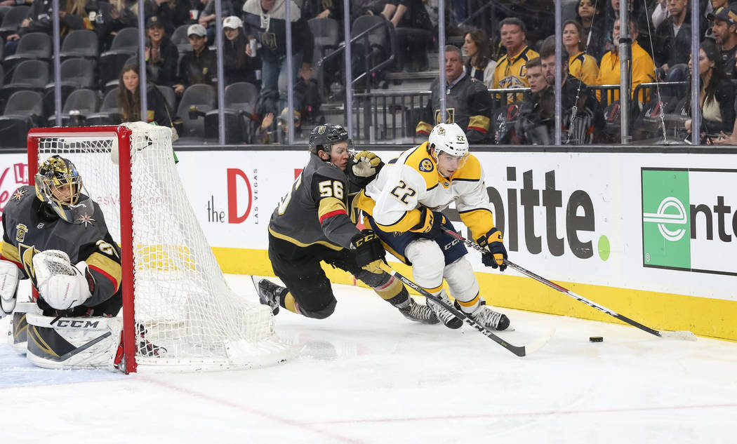 Nashville Predators left wing Kevin Fiala (22) is pressured by Vegas Golden Knights left wing Erik Haula (56) as Knights goaltender Marc-Andre Fleury protects his net during the second period of a ...