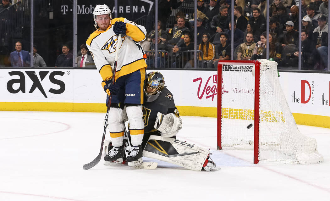 Nashville Predators center Colton Sissons (10) collides with Vegas Golden Knights goaltender Marc-Andre Fleury (29) during the second period of an NHL hockey game between the Vegas Golden Knights ...