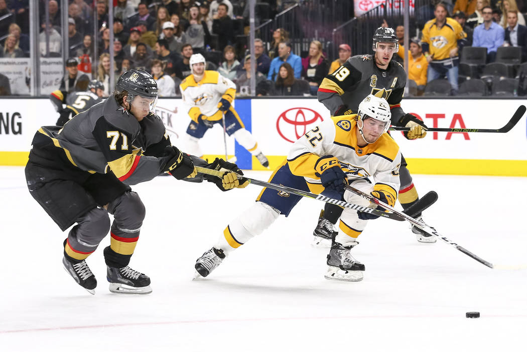 Vegas Golden Knights center William Karlsson (71) and Nashville Predators left wing Kevin Fiala (22) vie for the puck during the second period of an NHL hockey game between the Vegas Golden Knight ...