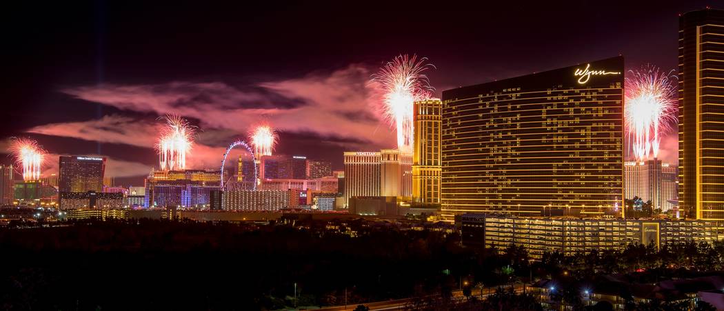 The fireworks of America's Party 2018 explode over the Las Vegas Strip to welcome the new year in this view from the rooftop of the Convention Center Marriott in Las Vegas on Monday, Jan. 1, 2018. ...