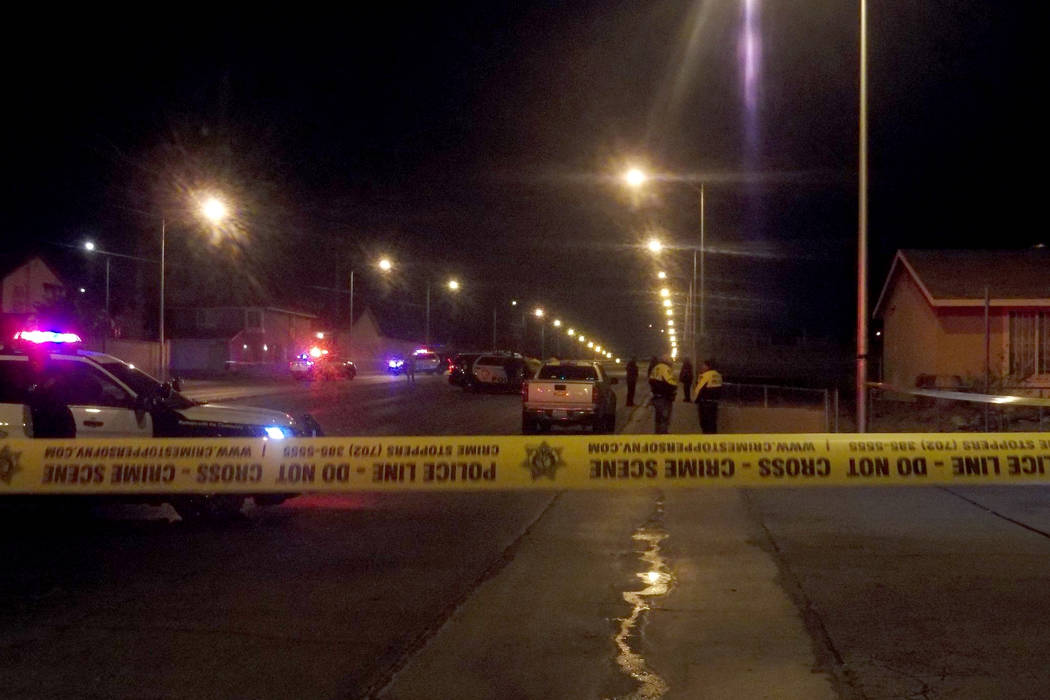 Police investigate at the scene near Lamb Boulevard and Alexander Road on Sunday, Dec. 31, 2017, after a man was shot to death. (Max Michor/Las Vegas Review-Journal @MaxMichor)