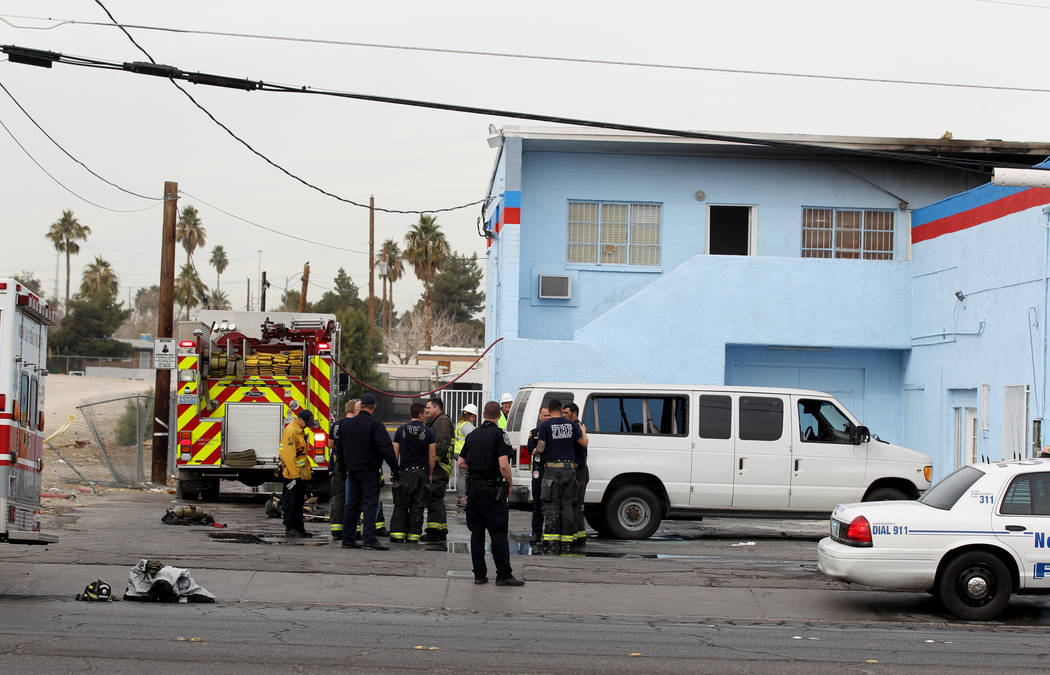North Las Vegas firefighters investigate a fire at an abandoned building at 2055 Las Vegas Blvd. North near East Lake Mead Boulevard that killed one person and injured three others, Tuesday, Jan.  ...