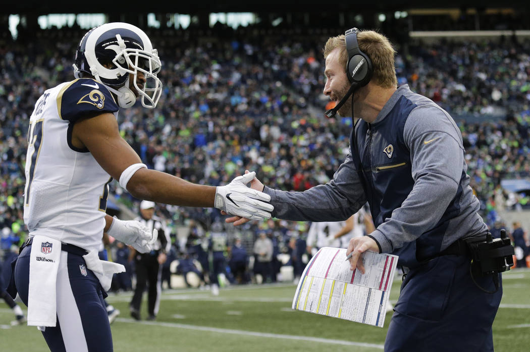 Los Angeles Rams head coach Sean McVay, right, greets wide receiver Robert Woods, left, after Rams' Todd Gurley scored a touchdown in the first half of an NFL football game, Sunday, Dec. 17, 2017, ...