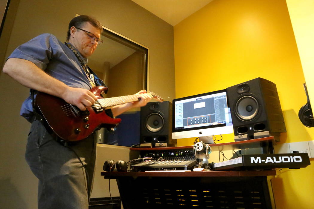 Adult Services Librarian Demosthenes Papaeliou takes advantage of the small recording studio at the Clark County Library’s Teen Tech Center which gives kids access to high-tech electronics  ...