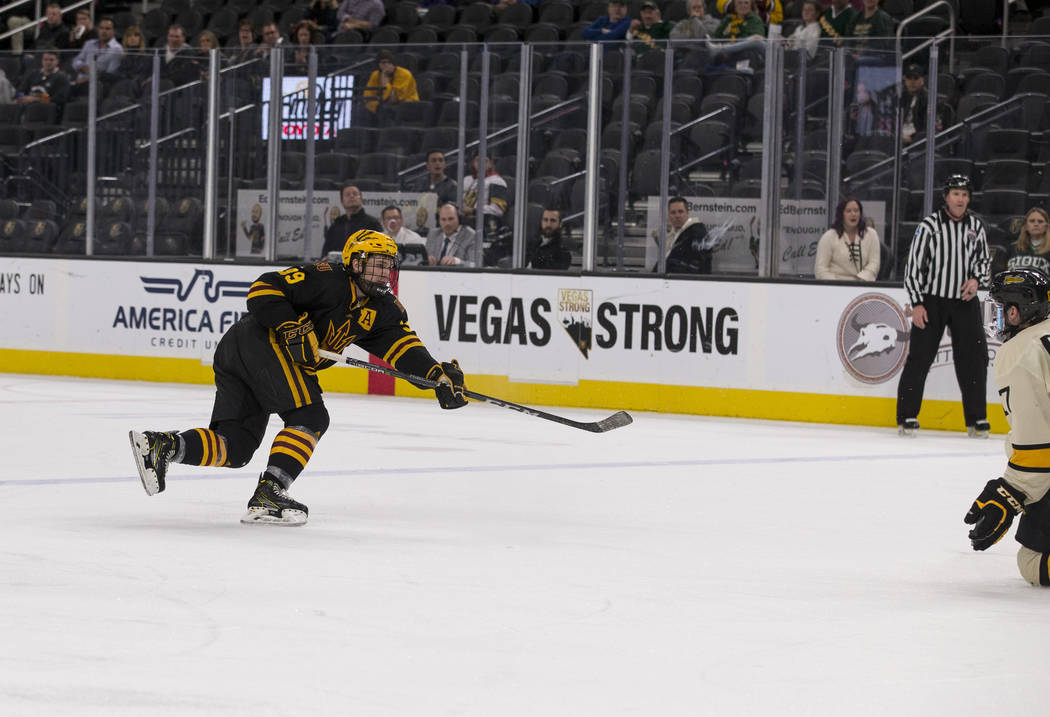 Arizona State Sun Devils defenseman Brinson Pasichnuk (39) takes a slap shot for a goal against the Michigan Tech Huskies during the inaugural Ice Vegas Invitational college hockey tournament at T ...