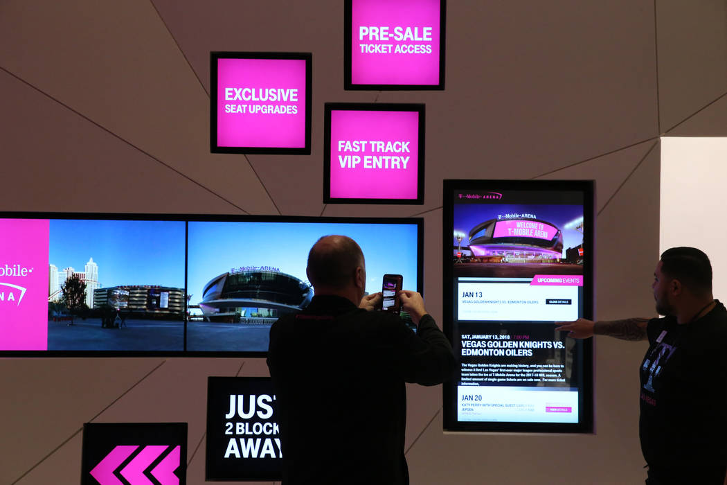 T-Mobile Executive Vice President for U.S. Sales and Operations Jon Freier, does a Periscope live broadcast on opening night of the nightclub-themed signature store on the Strip Thursday, Jan. 4,  ...