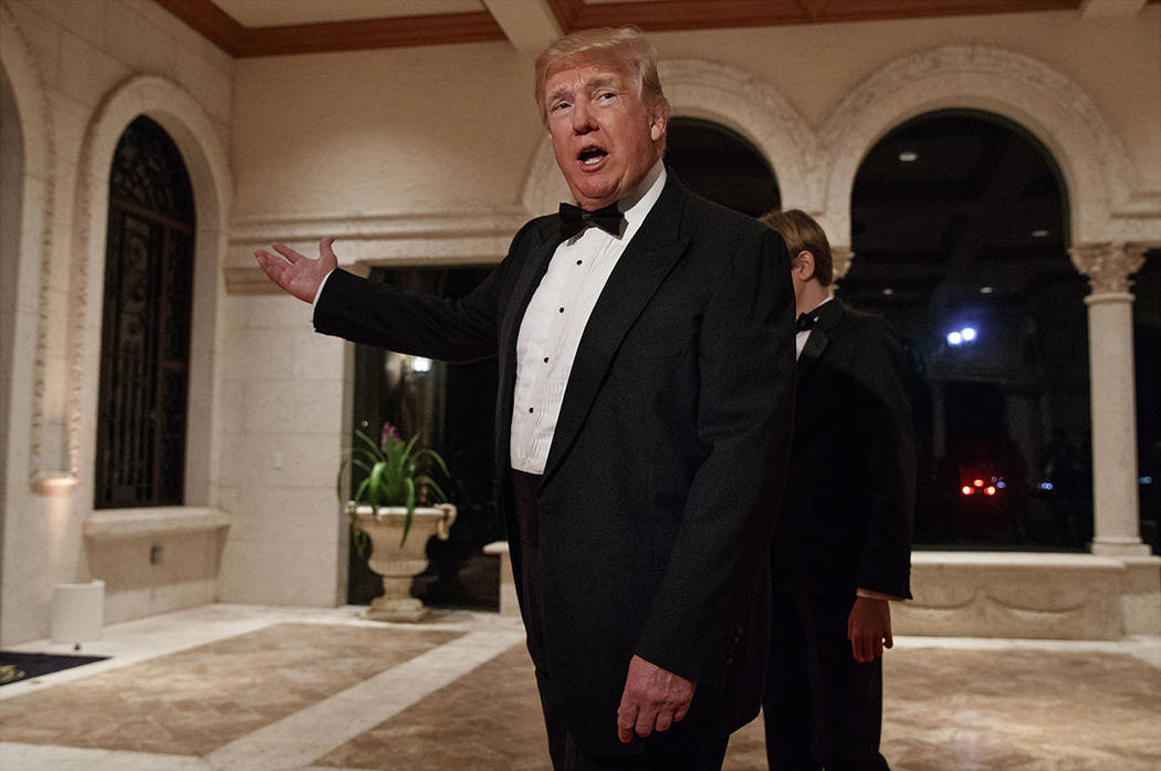 In this Sunday, Dec. 31, 2017 file photo, President Donald Trump speaks with reporters as he arrives for a New Year's Eve gala at his Mar-a-Lago resort, in Palm Beach, Fla. Trump slammed Pakistan  ...