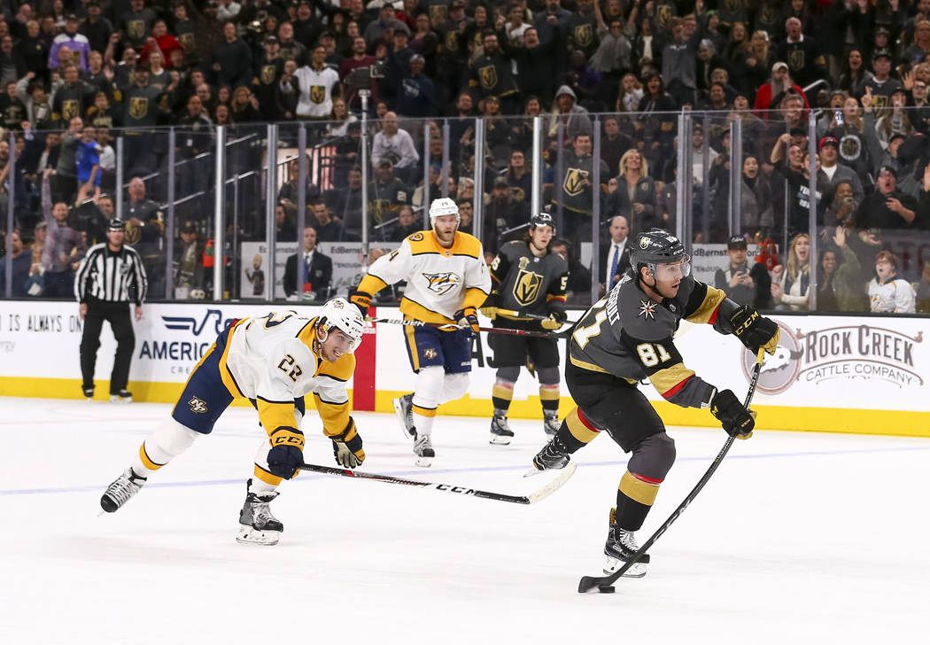 Vegas Golden Knights center Jonathan Marchessault (81) breaks away from Nashville Predators left wing Kevin Fiala (22) to score an empty-net goal during the third period of an NHL hockey game betw ...