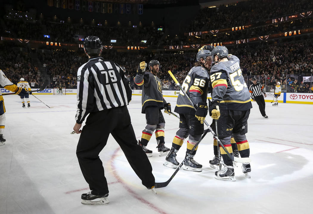 Vegas Golden Knights Erik Haula (56) and David Perron (57) celebrate a third period goal by Jonathan Marchessault during an NHL hockey game against the Nashville Predators at the T-Mobile Arena in ...