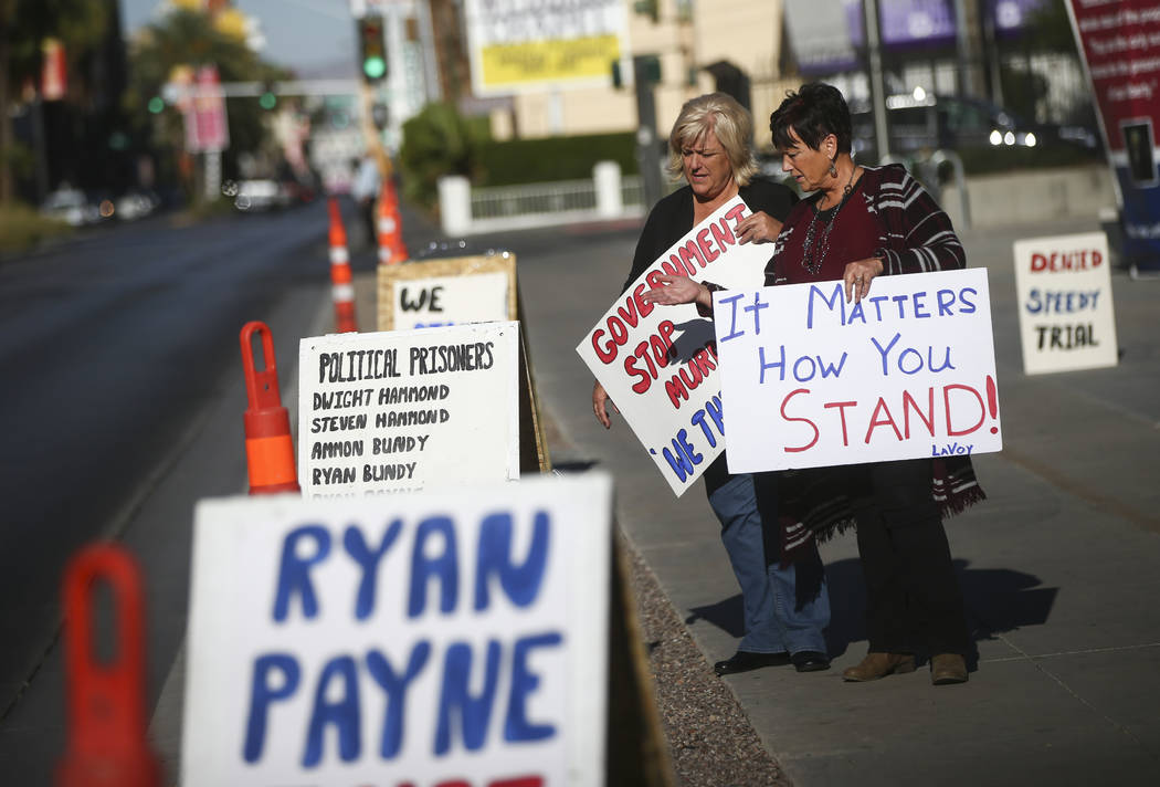 Lillie Spencer, left, and Margaret Houston hold signs in support of the Bundy family and others outside the in Lloyd George U.S. Courthouse in downtown Las Vegas on Tuesday, Nov. 14, 2017. Opening ...