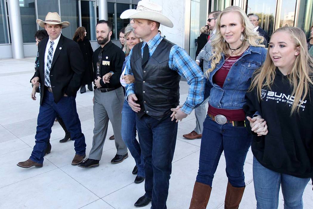 Carol Bundy, from left, Ammon Bundy, Ryan Payne, Jeanette Finicum, Ryan Bundy, his wife, Angie, and his daughter, Jamie, walk out of the Lloyd George U.S. Courthouse Wednesday, Dec. 20, 2017, afte ...