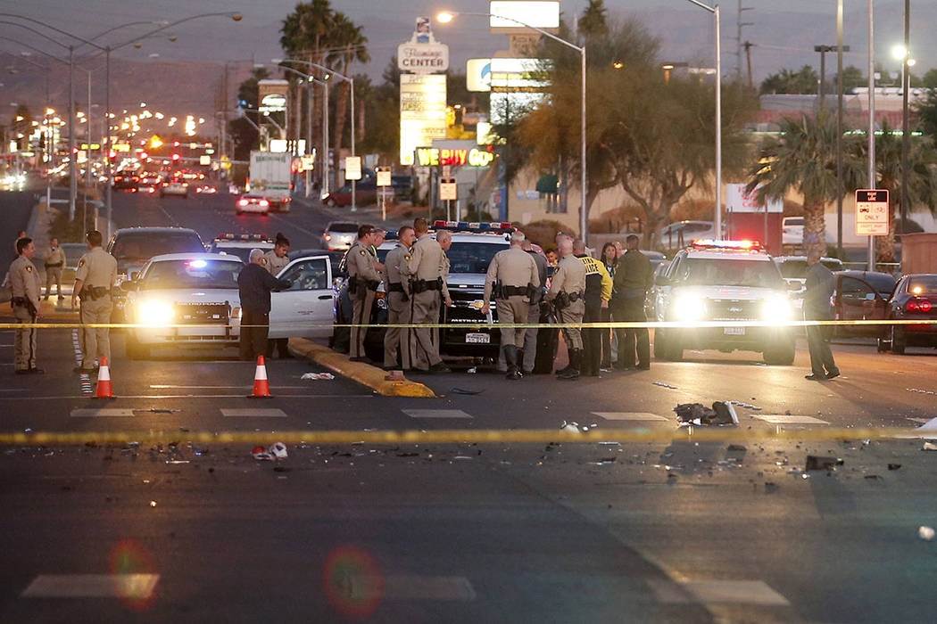 Las Vegas police in the intersection of Eastern Avenue and Flamingo Road where a multiple-vehicle crash left three people dead Wednesday, Dec. 13, 2017. Police said seven people were transported t ...