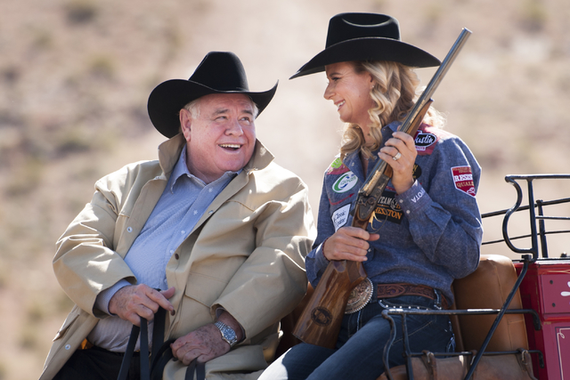 Michael Gaughan, left, owner of the South Point Hotel and Casino in Las Vegas, and Champion Barrel Racer Sherry Cervi share a laugh during a promotional photo shoot for the National Finals Rodeo. ...