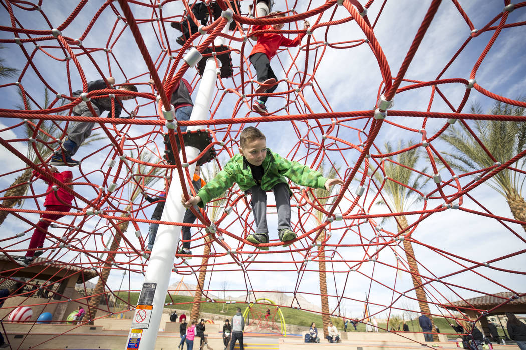 Children play on a 32-foot climbing tower at Summerlin's Fox Hill Park in The Paseos village neighborhood, Saturday, Jan. 6, 2018, in Las Vegas. Richard Brian Las Vegas Review-Journal @vegasphotograph