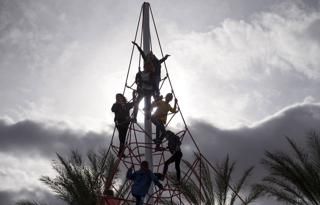 Children play on a 32-foot climbing tower at Summerlin's Fox Hill Park in The Paseos village neighborhood, Saturday, Jan. 6, 2018, in Las Vegas. Richard Brian Las Vegas Review-Journal @vegasphotograph