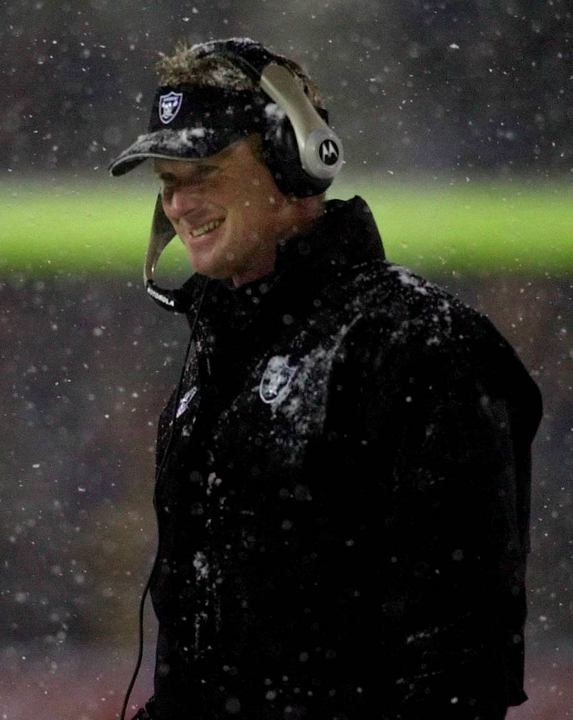 Oakland Raiders head coach Jon Gruden smiles during the first half at the AFC Divisional Playoff game against the New England Patriots at Foxboro Stadium, in Foxboro, Mass., Saturday Jan. 19, 2002 ...