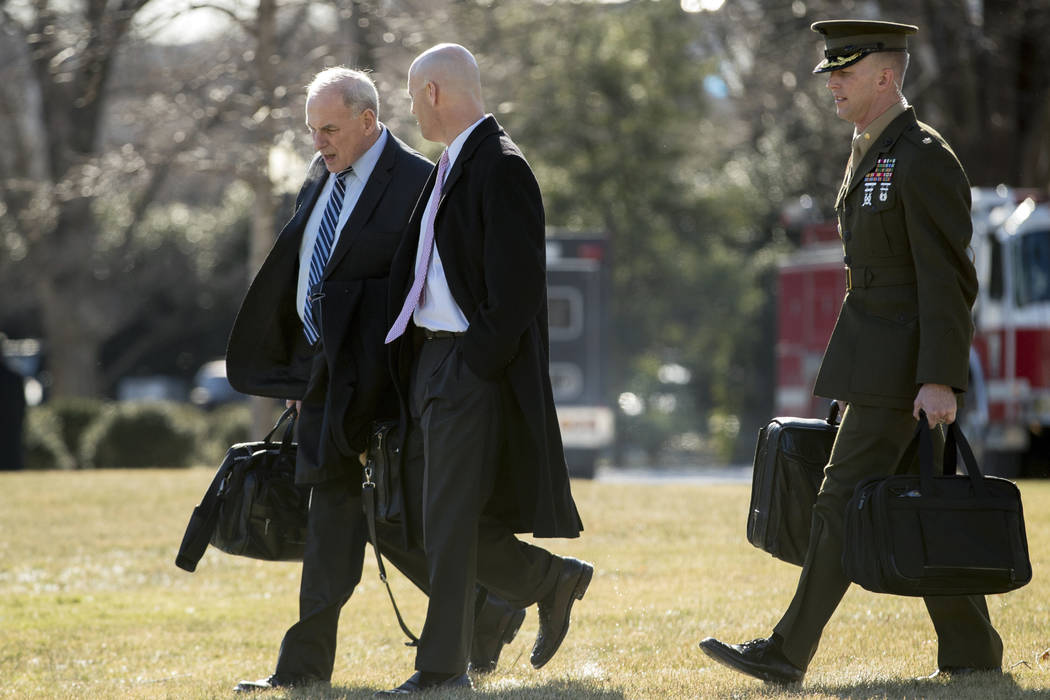 President Donald Trump's Chief of Staff John Kelly, left, and White House Director of Legislative Affairs Marc Short, second from left, walk toward Marine One on the South Lawn of the White House  ...