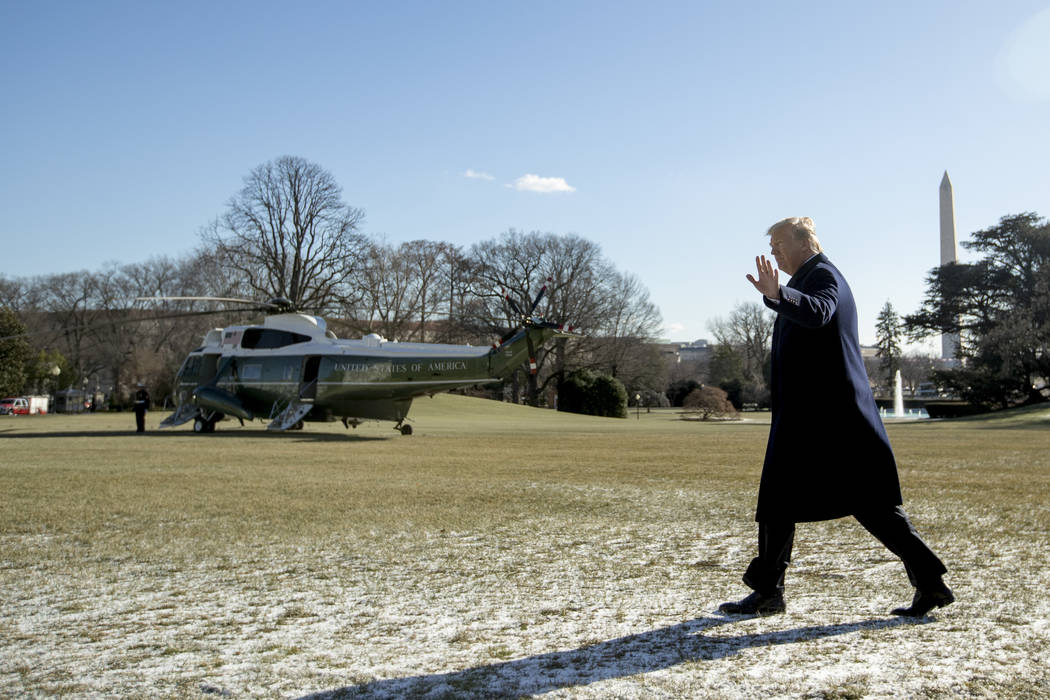 President Donald Trump waves to members of the media as he walks towards Marine One on the South Lawn of the White House in Washington, Friday, Jan. 5, 2018, to travel to Camp David in Maryland. ( ...